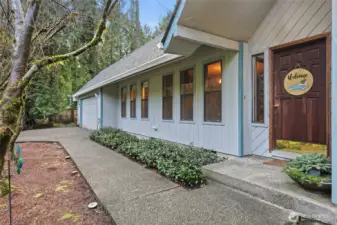 Vaulted porch is stylish and inviting; while new roof and gutters provide great protection and peace of mind.