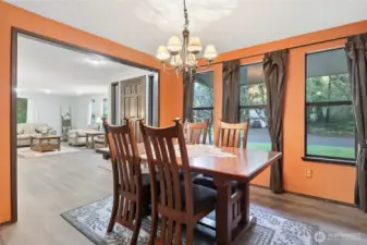 Dining room and entry seen from kitchen/family room doorway.