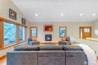 Alternate view of living room with fireplace and open sightlines