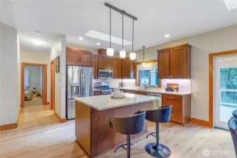 Kitchen with large island, breakfast bar seating, and ample counter space
