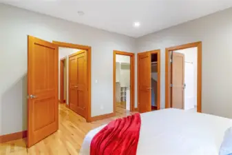 Primary bedroom with access to ensuite and closet areas