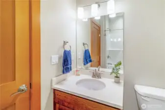 Full bathroom with vanity and storage