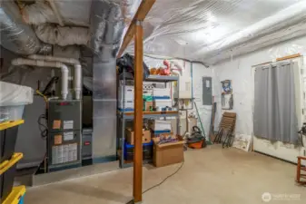 Large, dry crawl space with concrete flooring and storage