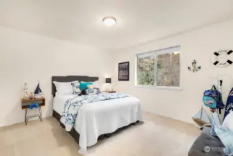 Large second bedroom with two closet systems and radiant ceiling heat.