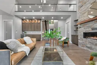 Glass railing overlooking living room.