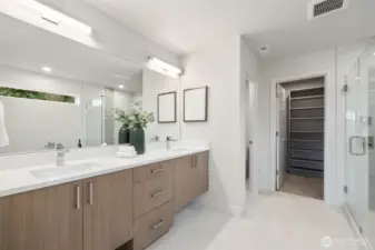 Double sinks, look over to the walk in closet