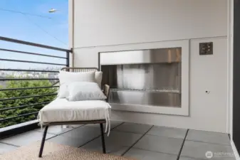 Outdoor fireplace under covered patio