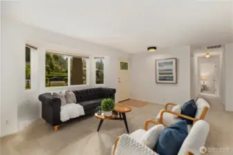 From the living room, the heart of the home, head down to the bedroom wing of the house or over to the family room and kitchen.