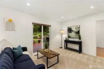From the kitchen, step into the family room with sliders out to your show-stopper back deck and backyard.