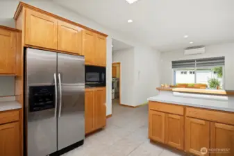 Looking toward the dining area with the laundry room to the left.
