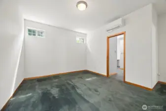Another view of the primary suite with its own mini-split over the door leading to the 3/4 bath.