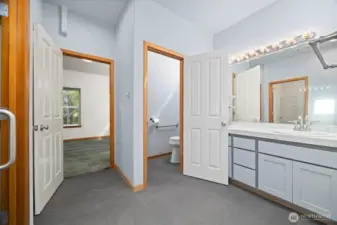 The primary bath has a linen storage closet and a separate toilet room.