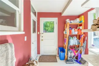 Laundry room in the back off the kitchen on the main floor that heads to the side yard or down into the basement.