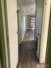 View from bedroom down hall to living
