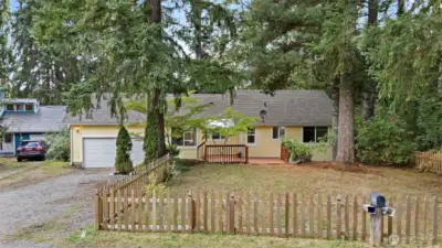 Charming picket fenced front yard!