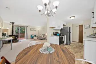From the corner of dining area viewing the living and kitchen