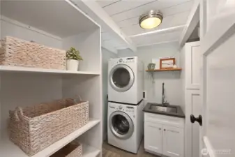 Efficient laundry room with utility sink.