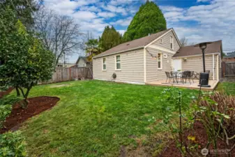 Fully fenced backyard with new trex deck.