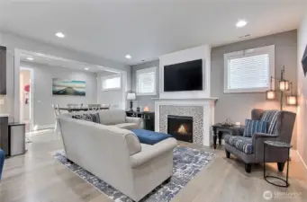 This cozy gathering space is the heart of the home, radiating warmth and comfort with a sleek gas fireplace. Perfect for movie nights or game days, the included 65-inch TV makes entertaining effortless. Thoughtfully designed to flow with the property, it’s a space where family and friends will naturally come together, creating memories that linger long after the fire dies down.