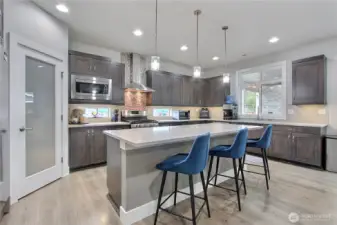 Get your heart flowing in this well-appointed kitchen, where every detail is designed for both style and function. With abundant space, thoughtful layout, and high-end finishes, this kitchen is as incredible to cook in as it is to gather around.
