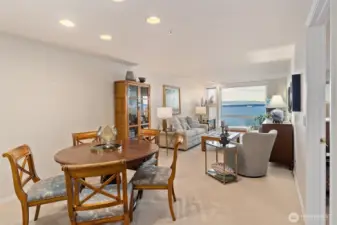 The dining area flows seamlessly into the living room, creating an open, inviting space that’s perfect for entertaining and gathering with ease.