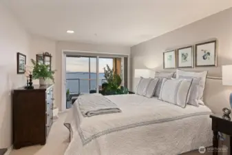 The primary suite features access to the view deck, where you can enjoy an ever-changing parade of marine traffic. The view deck is also accessible from the living room, creating a seamless indoor-outdoor flow and perfect vantage points for relaxing or entertaining.