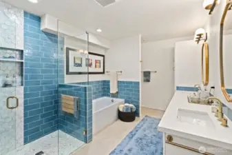 The updated 5-piece primary bath exudes a spa-like ambiance, offering the perfect place to unwind, refresh, and start or end your day in total relaxation.