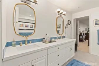 The updated 5-piece primary bath exudes a spa-like ambiance, offering the perfect place to unwind, refresh, and start or end your day in total relaxation.