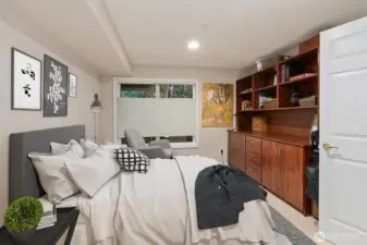 (This room is virtually staged with the bed added). The guest room features a charming built-in to the right and connects directly to the guest bath, creating a convenient and private ensuite.