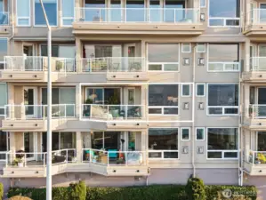 Unit #302 is the second one up, located in the center of the building as shown in the photo.