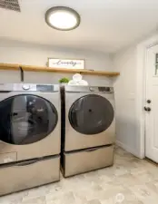 Washer and dryer stay. Extra storage in pedestals. Back door to the right to the covered back porch.