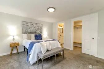Primary bedroom with full bathroom and closet.