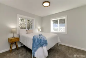 This bedroom faces the front of the house and carport.