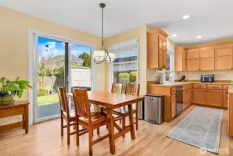 Kitchen dining and slider to backyard.