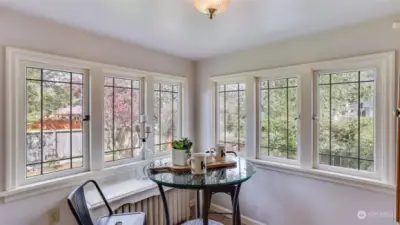 Picturesque windows in this eating nook.