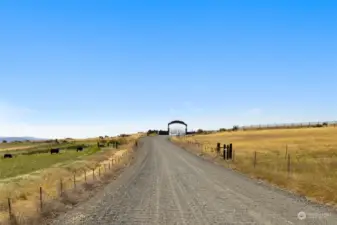 Gravel road up to the gate