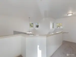 Second story balcony w/ hallway leading to two beds and full bath.