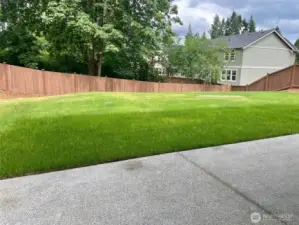 Photo is of actual home and large, private backyard under construction and on sale.