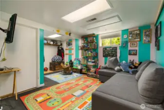 3rd bedroom in basement with lots of color and lots of room for you funiture