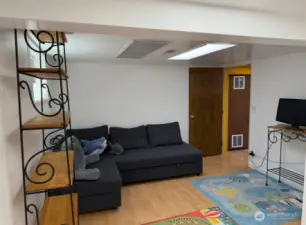Her is big 3rd bedroom on lower level also with hard wood flooring and new paint that could be bonus room or media room