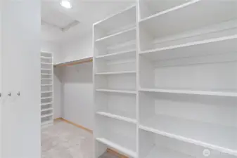 Part of the primary suite walk in closet.