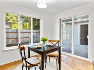 A quaint eating area attached to the kitchen