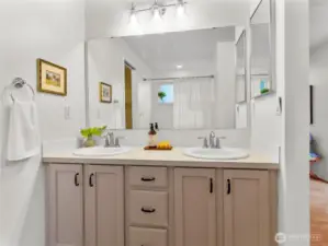Primary double vanity with separate shower & bath tub.