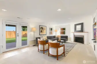 Heading to the lower level, you'll find the walk-out, daylight rec room! This room is adorable and provides access to the backyard via the outdoor living space under the waterproof deck above.