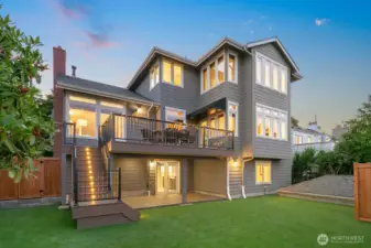 Looking at the home from the backyard. Those stairs have lights that come on automatically at dusk! The yard is STUNNING!