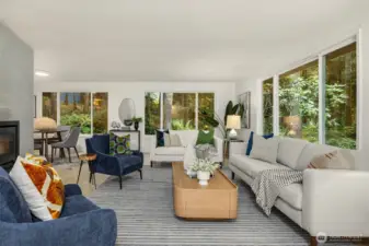Relax in the living room with tranquil views of evergreens and natural beauty.