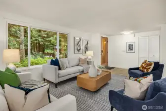 The entry opens seamlessly into the spacious living area, perfect for gatherings.