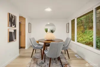 The dining room is perfectly situated between the kitchen and living room, ideal for entertaining and family meals.