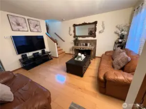 Cozy living room with a gas fireplace to keep you warm.