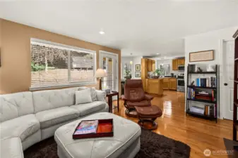 The spacious family room is open to the kitchen and breakfast nook, and features those gorgeous hardwood floors.